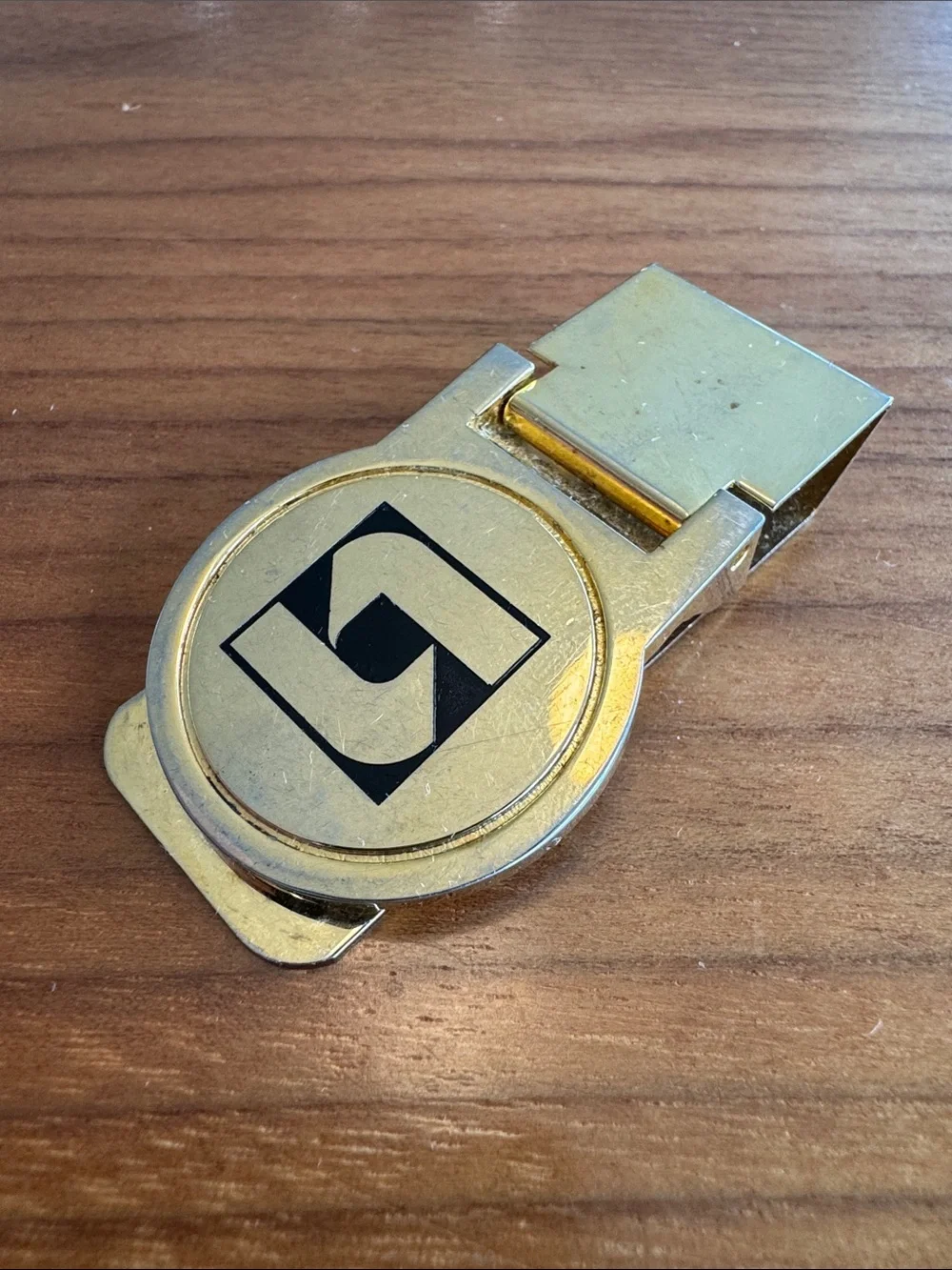 Vintage Gold-tone Money Clip with Abstract Black Logo
